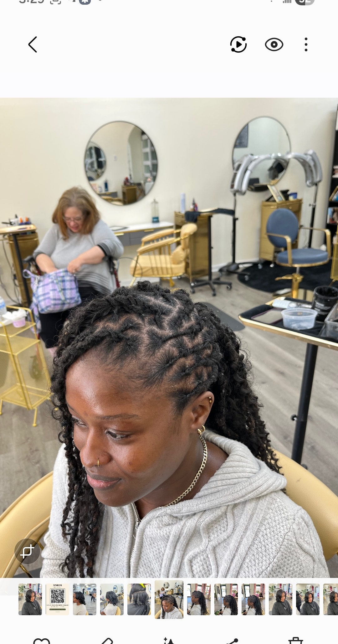 Locs near me — client getting dreadlocks styled by loctician at Sinkor Beauty Salon loc salon Middletown DE